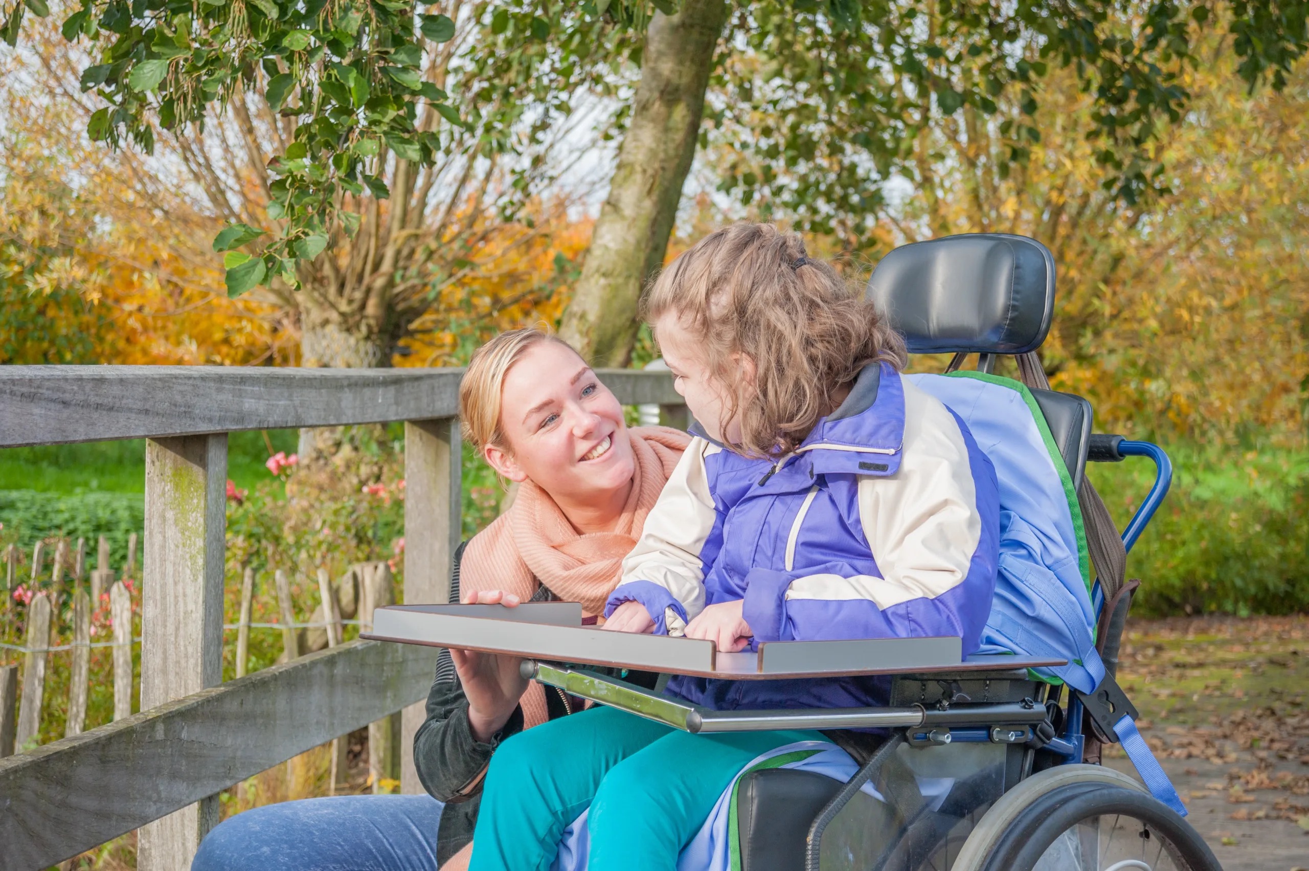 EMIC nurse working with a child and parent caregiver at home